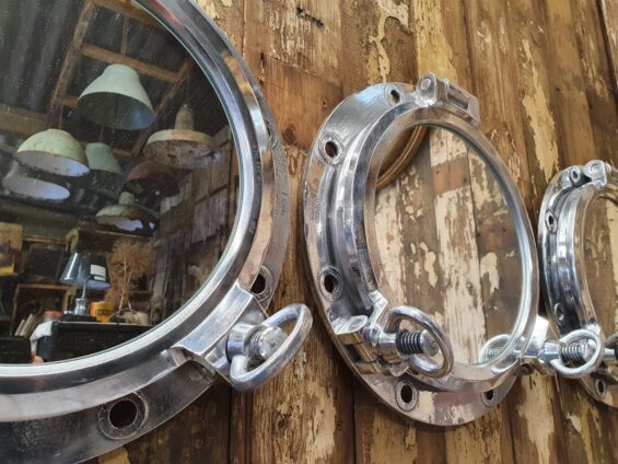 vintage polished porthole mirrors