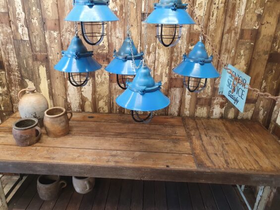A set of six blue factory pendent lights