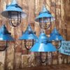 A set of six blue factory pendent lights