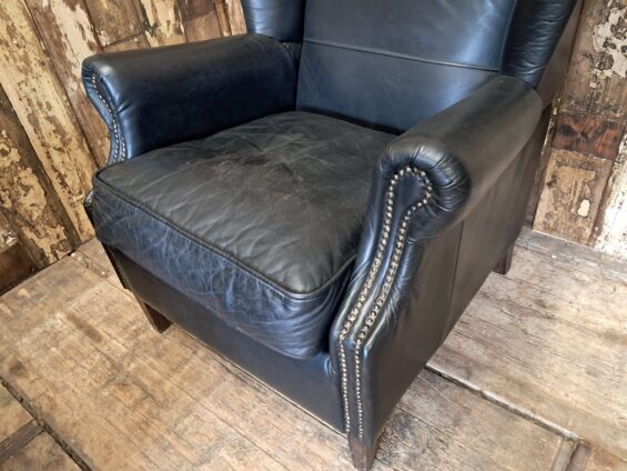 a pair of leather wingback armchairs seating armchairs