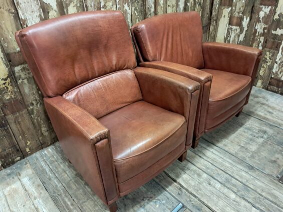 pair of leather club chairs seating armchairs