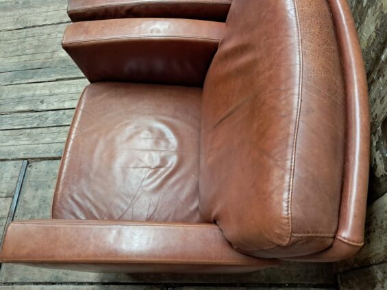 pair of leather club chairs seating armchairs