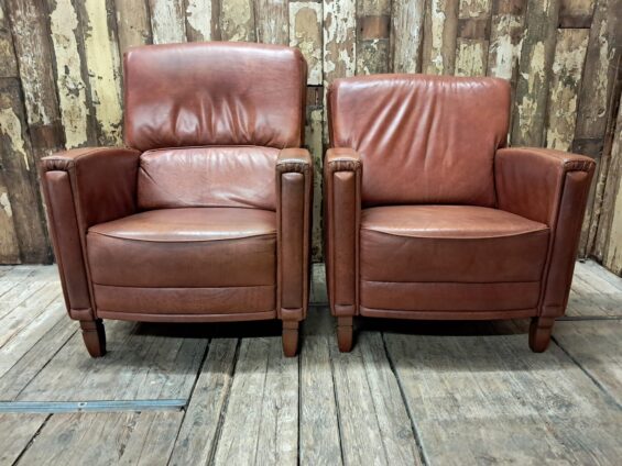 pair of leather club chairs seating armchairs