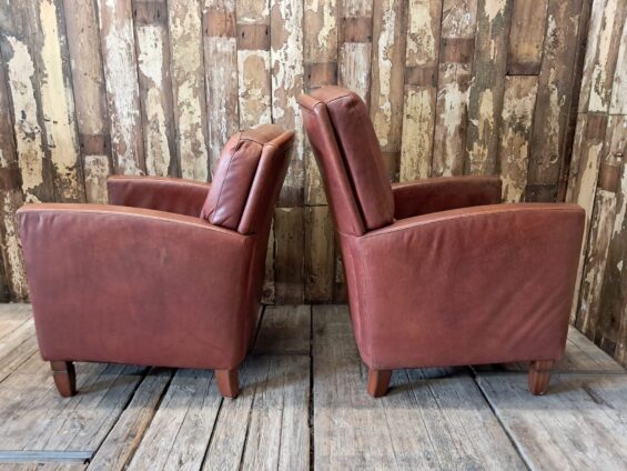pair of leather club chairs seating armchairs