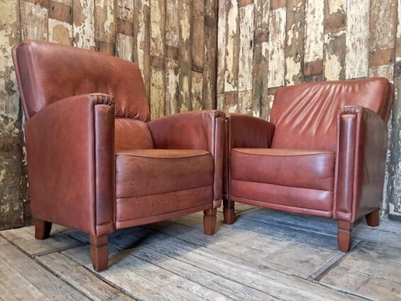pair of leather club chairs seating armchairs