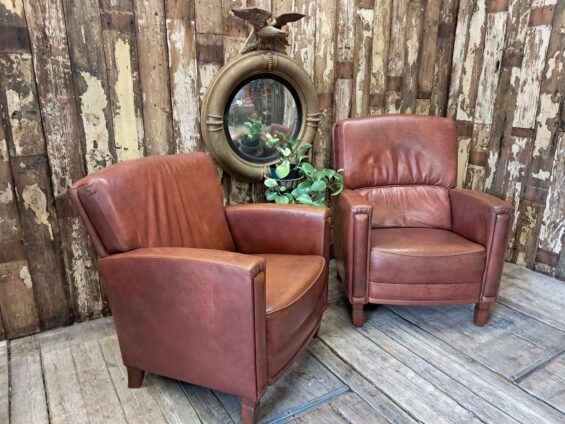 pair of leather club chairs seating armchairs