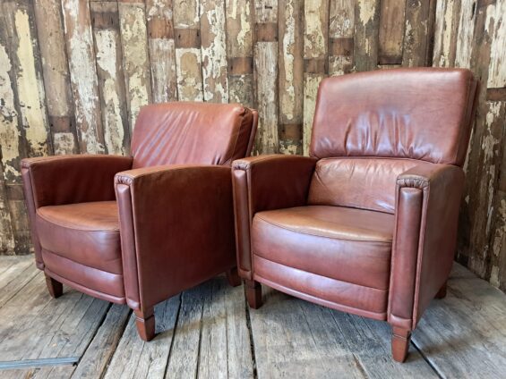 pair of leather club chairs seating armchairs