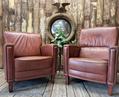 pair of leather club chairs seating armchairs