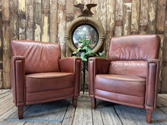pair of leather club chairs seating armchairs