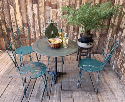 round cast iron table and steel carver chairs garden furniture